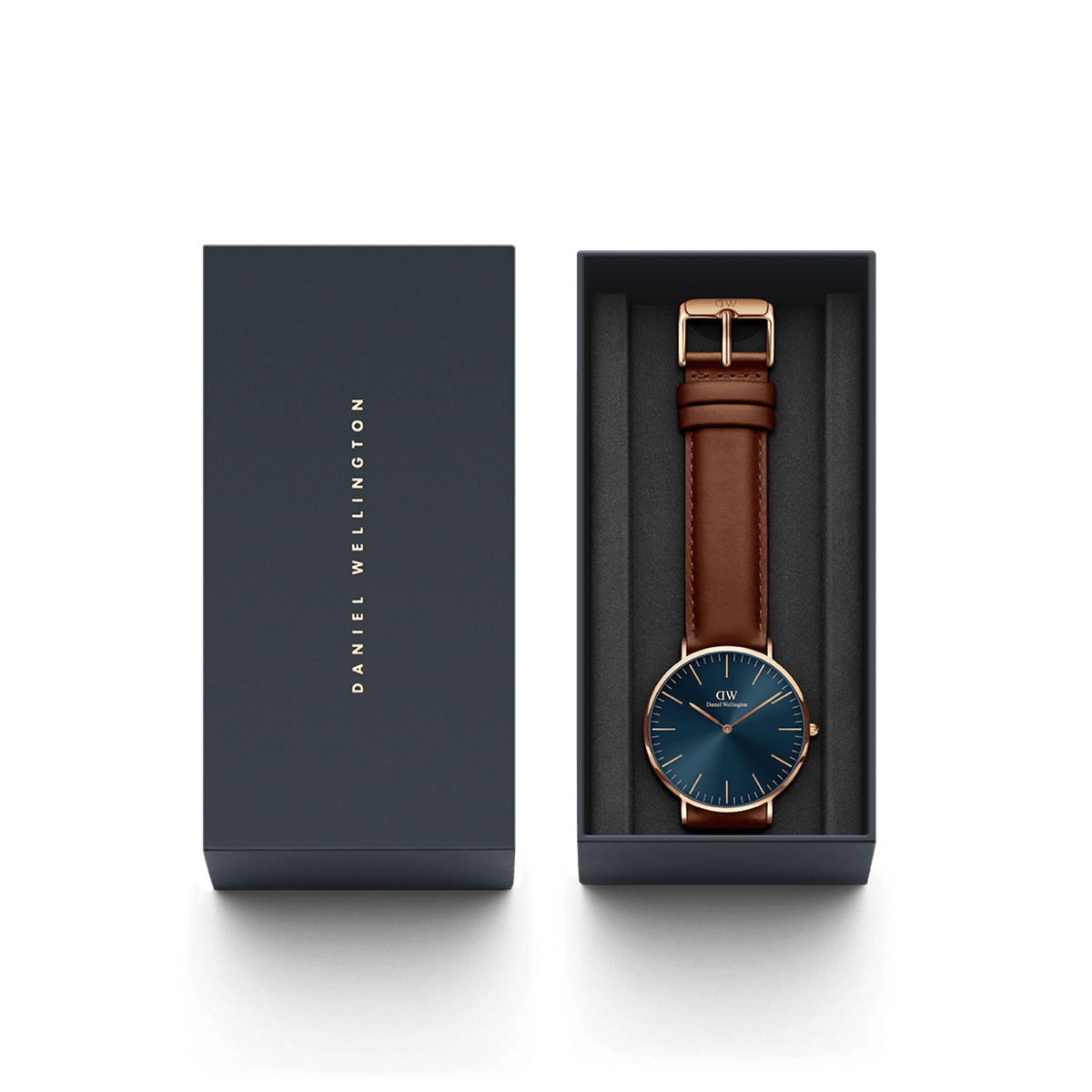 Classic St Mawes Arctic Rose Gold watch presented in a sleek Daniel Wellington gift box, featuring a blue sunray dial, rose gold case, and brown leather strap with matching buckle. The elegant packaging highlights the watch’s suitability for gifting and special occasions.