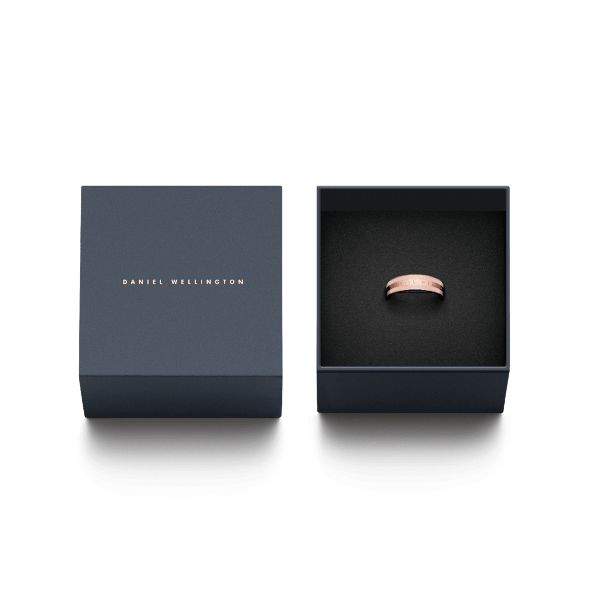 Emalie Ring Cherry Blossom Rose Gold Cherry displayed in an elegant Daniel Wellington gift box, highlighting the rose gold band with cherry blossom pink enamel and engraved logo, perfect for gifting or special occasions.