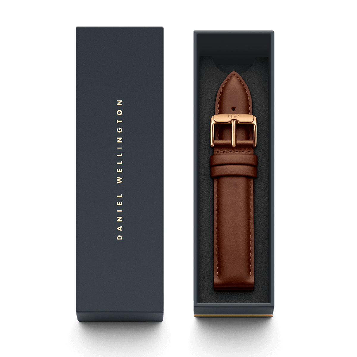 St Mawes XL Strap Rose Gold presented in a sleek Daniel Wellington gift box, featuring a light brown genuine leather strap with a polished rose gold buckle and refined stitching.