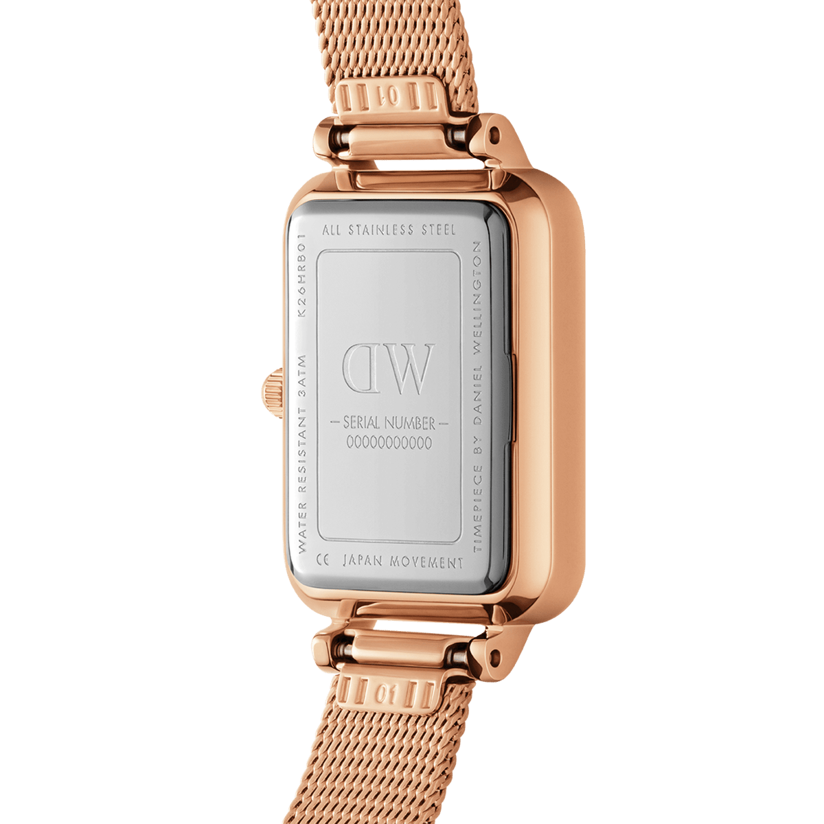 Close-up of the Quadro Pressed Unitone rose gold women’s watch showing the stainless steel case back, engraved details, and pressed mesh strap.