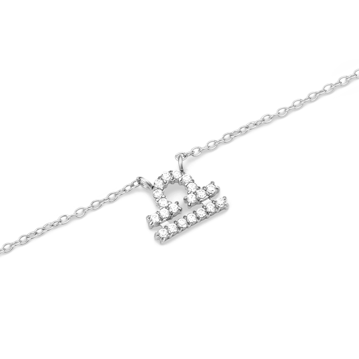 Delicate silver chain necklace featuring a Libra zodiac pendant adorned with sparkling hand-set crystals.