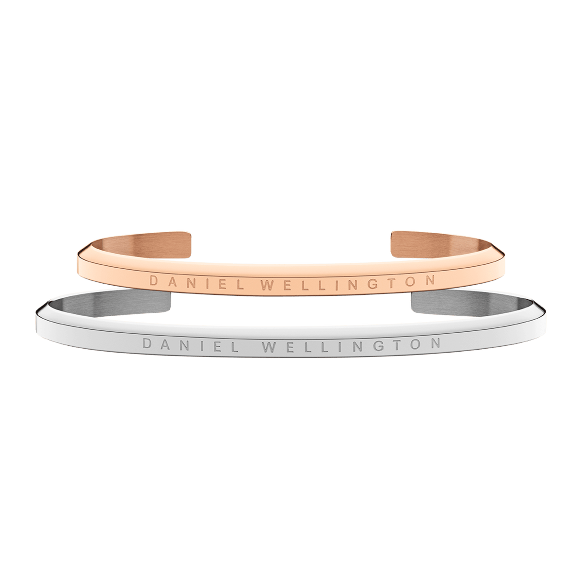 Classic rose gold and silver Daniel Wellington cuff bracelets, each featuring a minimalist open design and engraved logo, displayed as a refined unisex set.