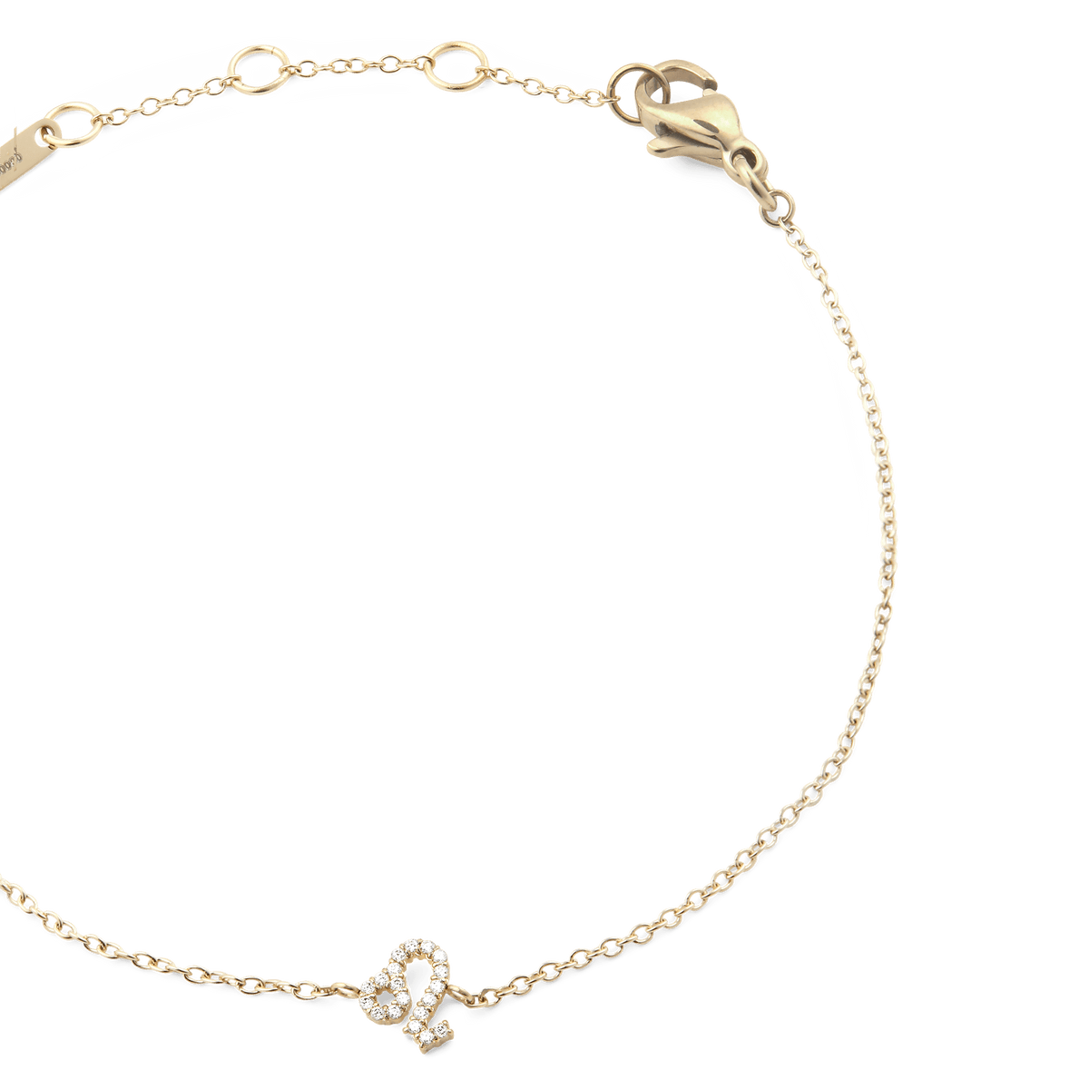 Close-up of a gold crystal zodiac chain bracelet featuring an adjustable clasp and a sparkling zodiac pendant on a fine chain.
