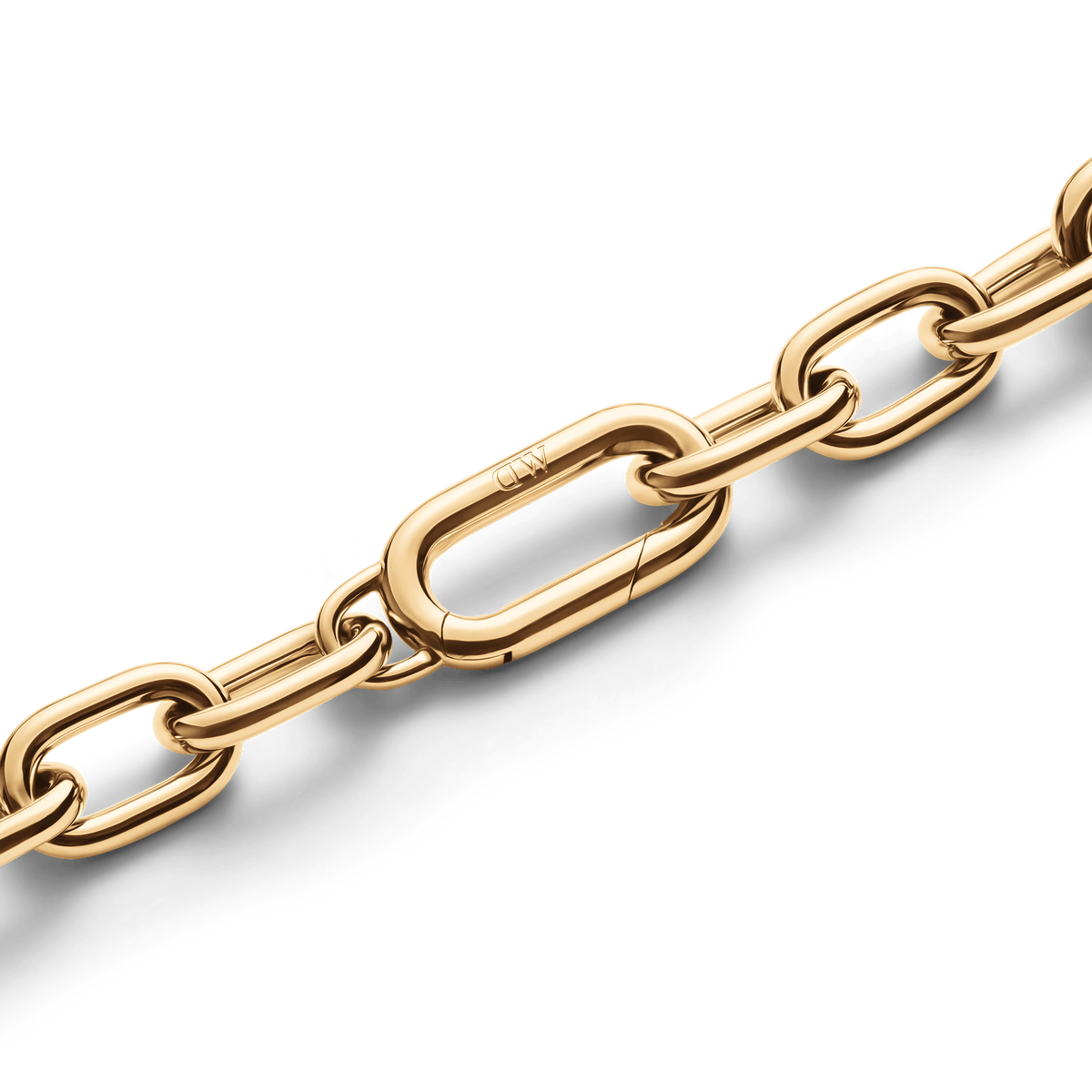 Detail of the Crystal Link Bracelet Gold showing polished gold chain links and the seamless spring gate clasp engraved with subtle branding.