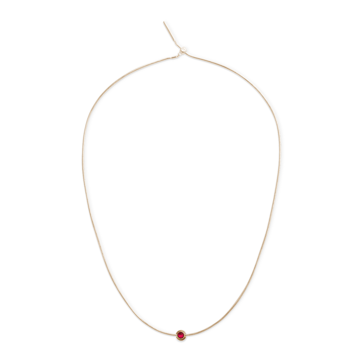 Fine gold chain necklace featuring a single round gold charm with a vivid red crystal centre, designed for a minimalist and elegant jewellery style.