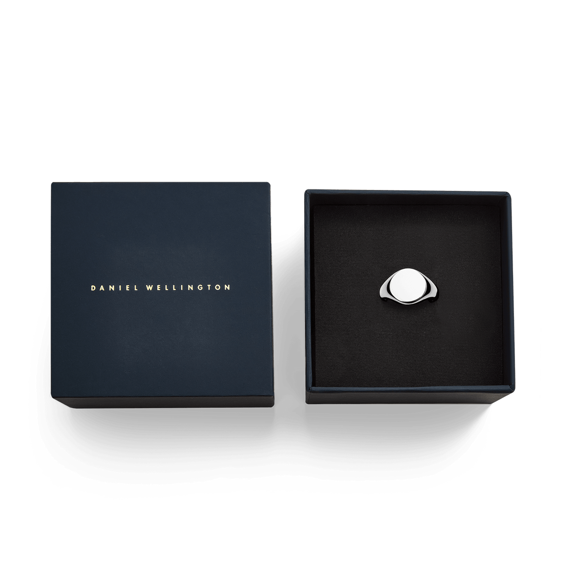 Classic Signet Ring Silver presented in a navy Daniel Wellington gift box, polished flat face, ideal for gifting.