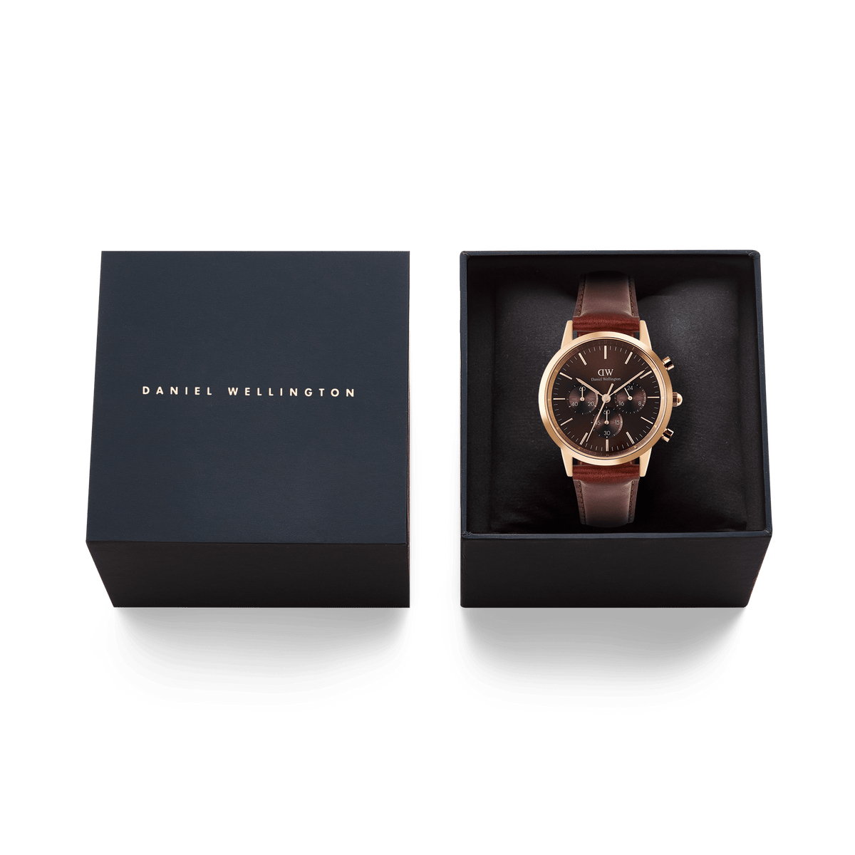 Iconic Chronograph St Mawes Amber RG men’s watch with a rose gold case and brown leather strap, presented in an open Daniel Wellington gift box alongside the branded lid.