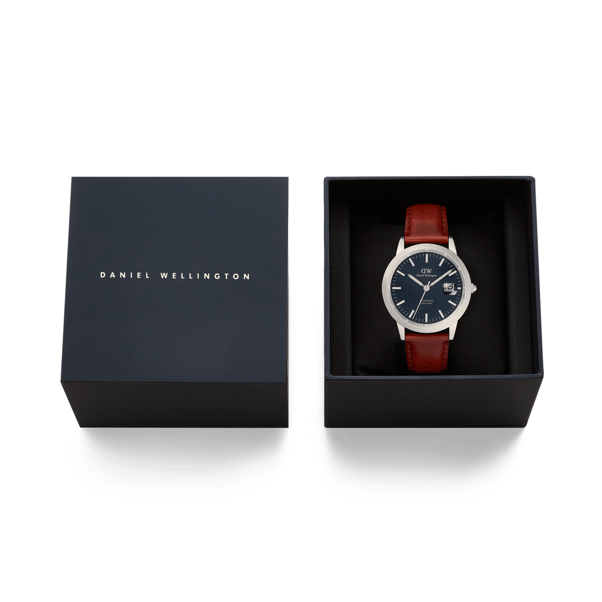 Iconic St Mawes Automatic Silver men’s watch with an arctic blue dial and brown leather strap, presented in an elegant Daniel Wellington gift box.