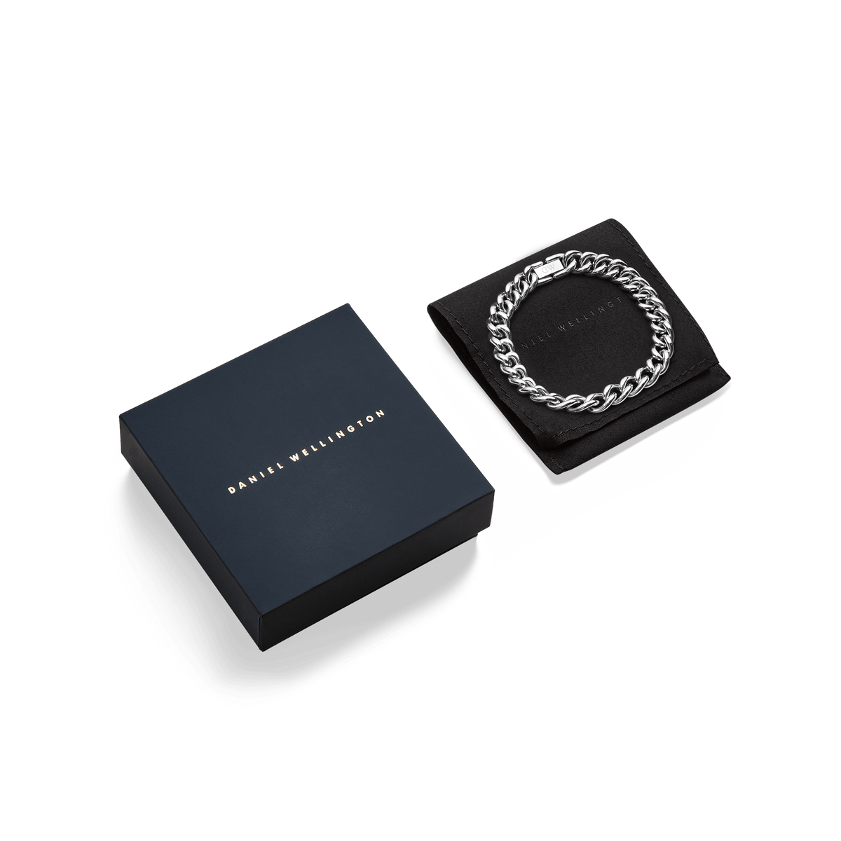 Chunky Chain Bracelet Silver displayed on a black cushion beside Daniel Wellington’s signature navy gift box, highlighting its polished stainless steel links and elegant presentation.