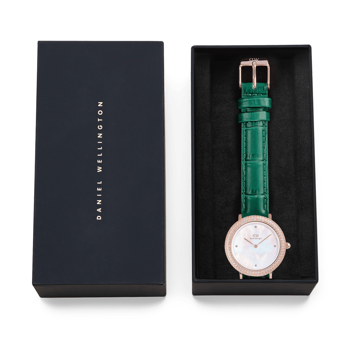 Crystalline Bezel Green Croc Rose Gold watch with a mother of pearl dial, sparkling rose gold case, and emerald green crocodile-textured leather strap, elegantly presented in a black Daniel Wellington gift box.
