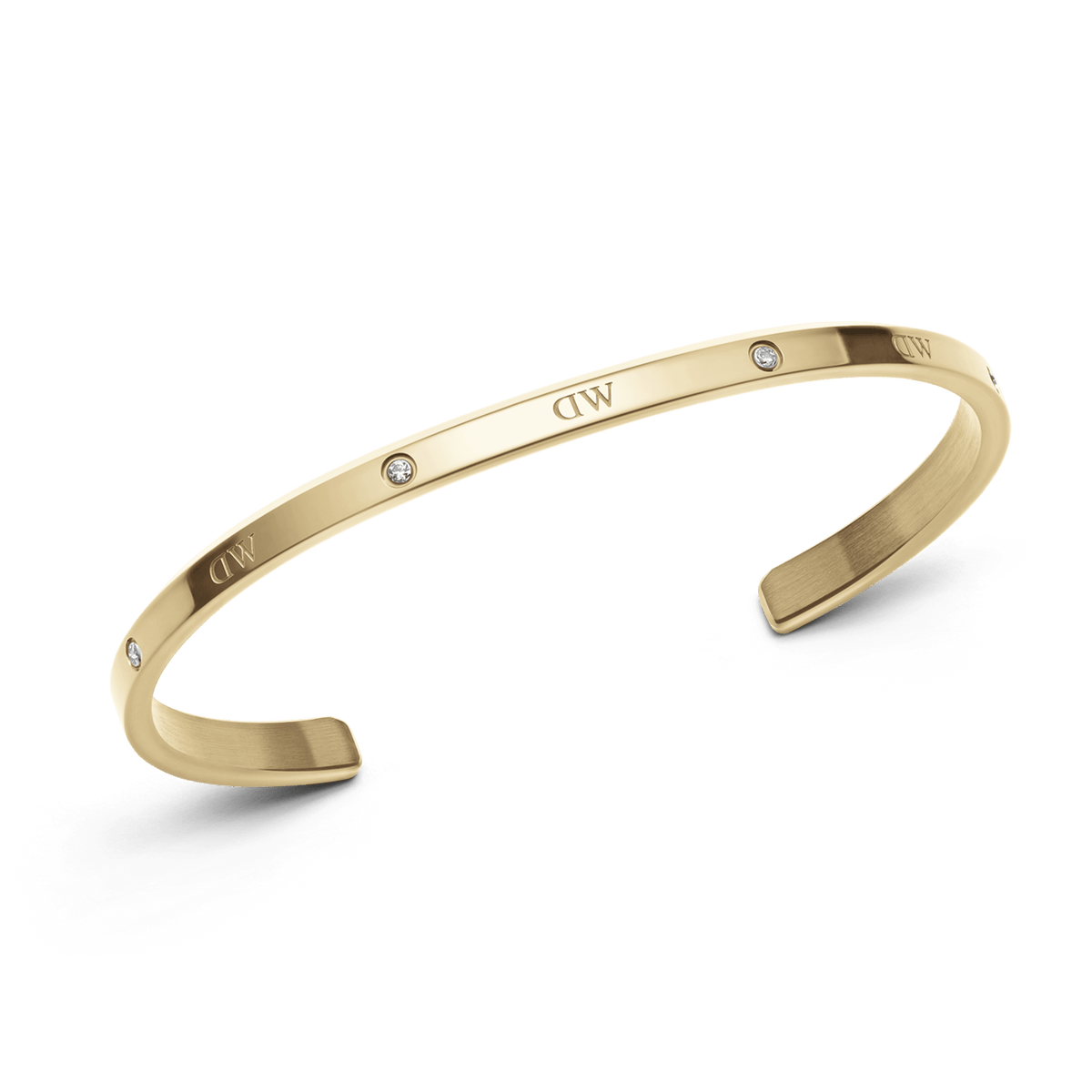 Classic Lumine Bracelet G featuring a slim, polished gold cuff with six sparkling crystals and subtle DW engraving, crafted from stainless steel for a refined, minimalist look.