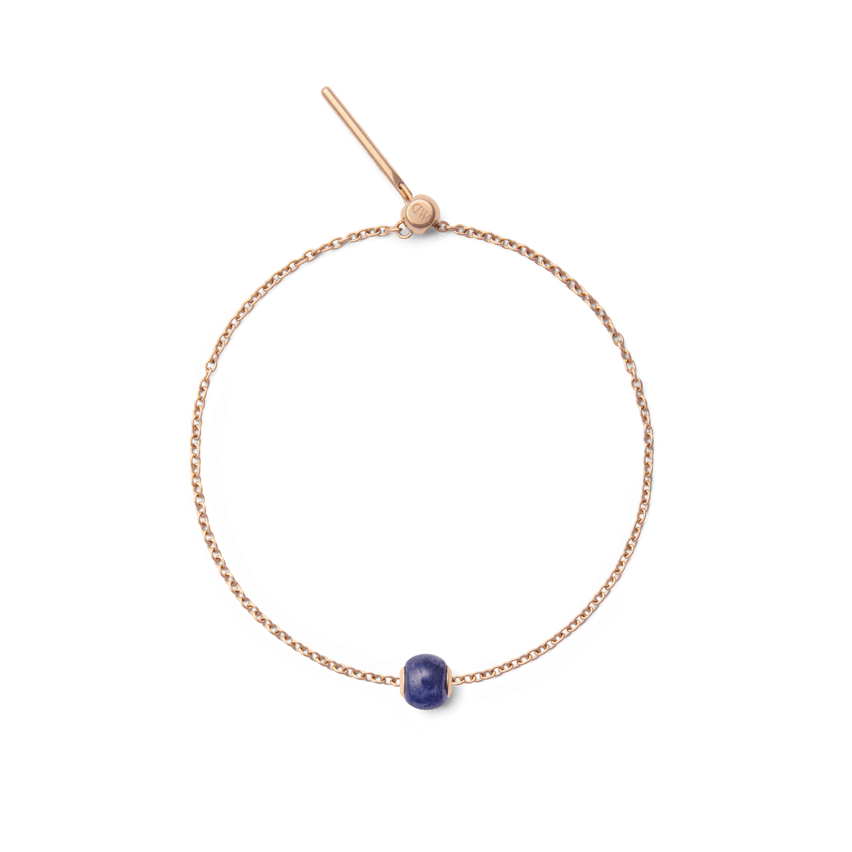 Rose gold bracelet featuring a single orb-shaped charm crafted from deep blue semi-precious stone, offering a minimalist and elegant accessory for everyday wear.