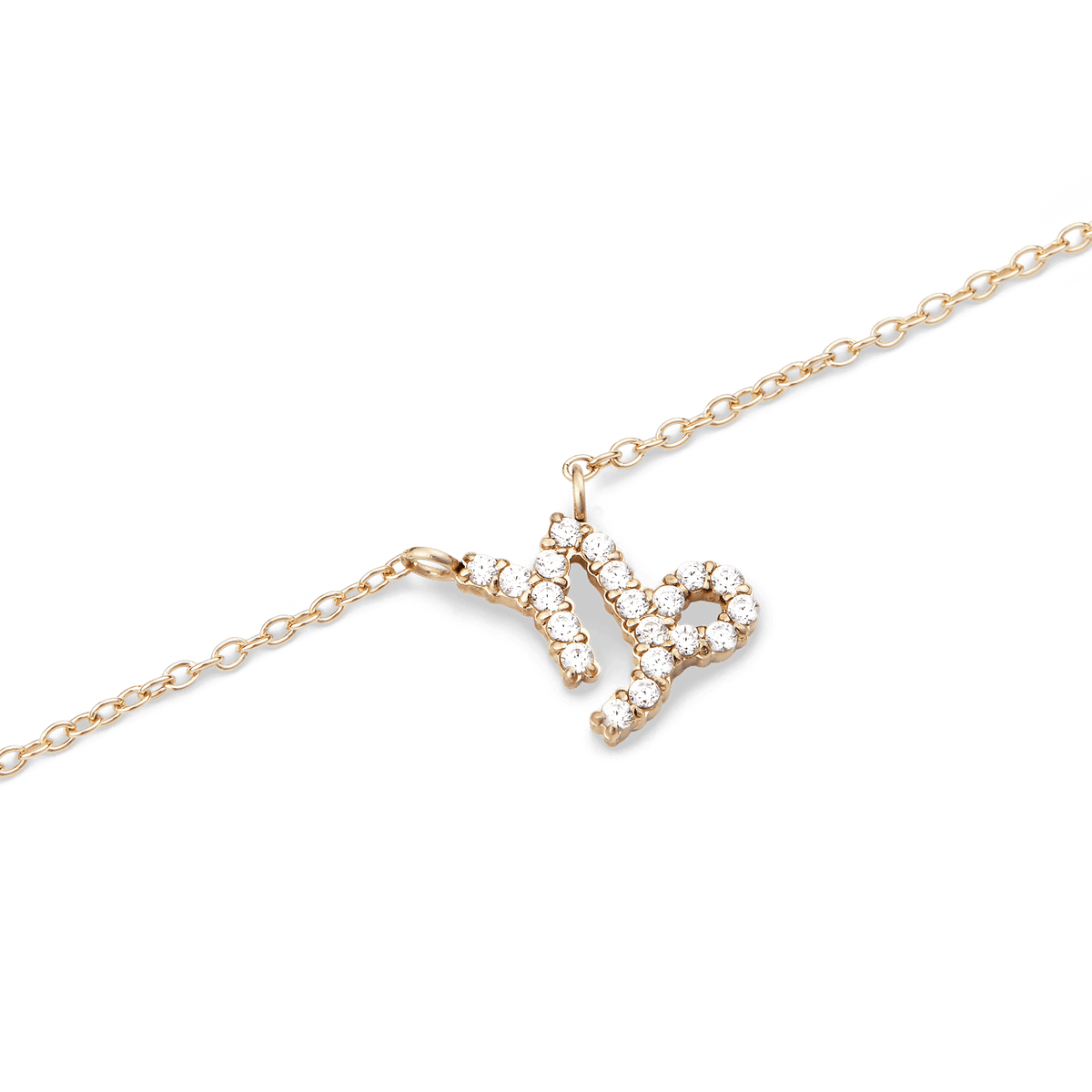 Delicate gold chain necklace featuring a Capricorn zodiac pendant adorned with sparkling hand-set crystals.