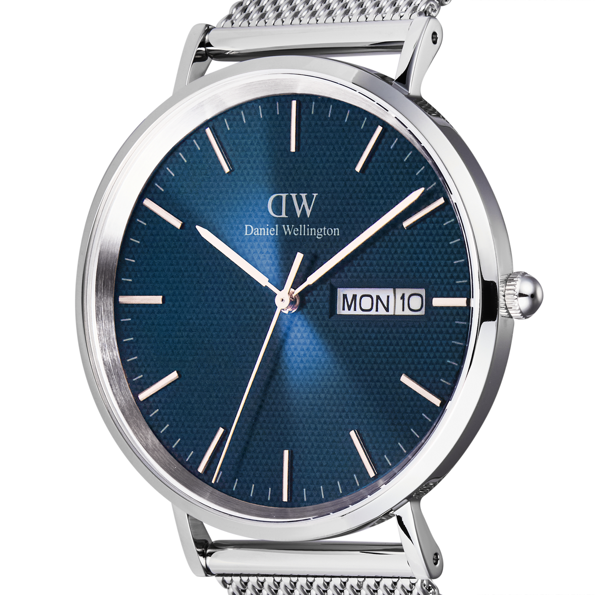 Close-up of the Daniel Wellington Classic Day Display Sterling Arctic watch, highlighting the textured blue dial, silver hour markers, and day-date window within a polished stainless steel case.