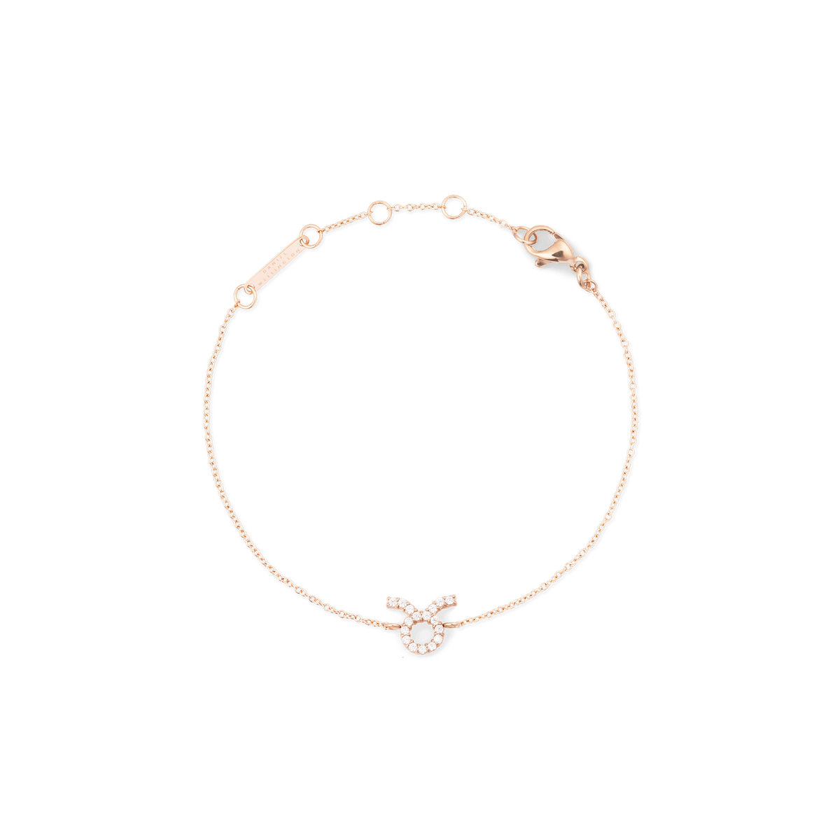 Rose gold chain bracelet featuring a delicate Taurus zodiac pendant adorned with hand-set crystals and an adjustable clasp.