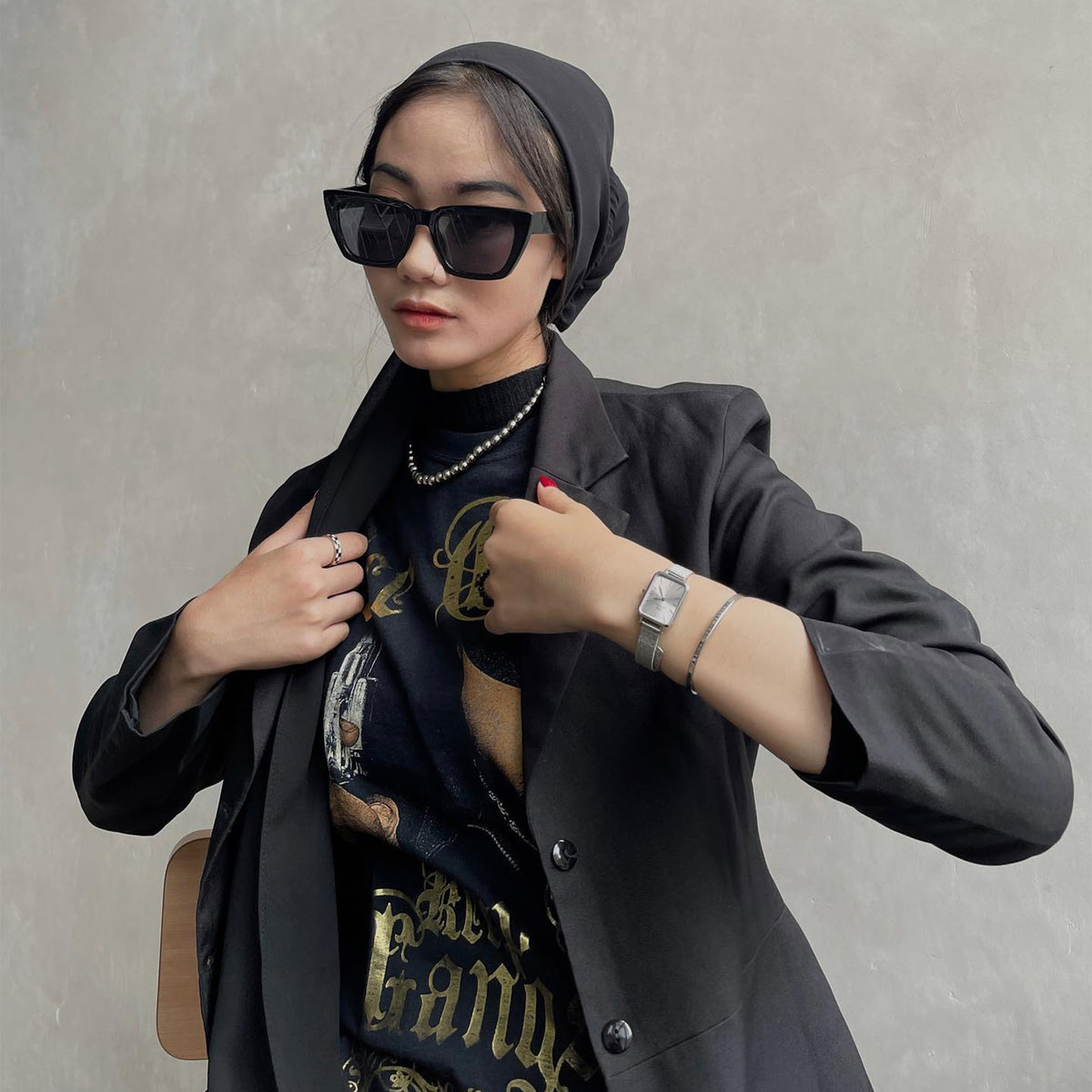 Quadro Pressed Unitone Silver ladies watch with mesh strap, styled with a black blazer, graphic tee, and silver jewellery.