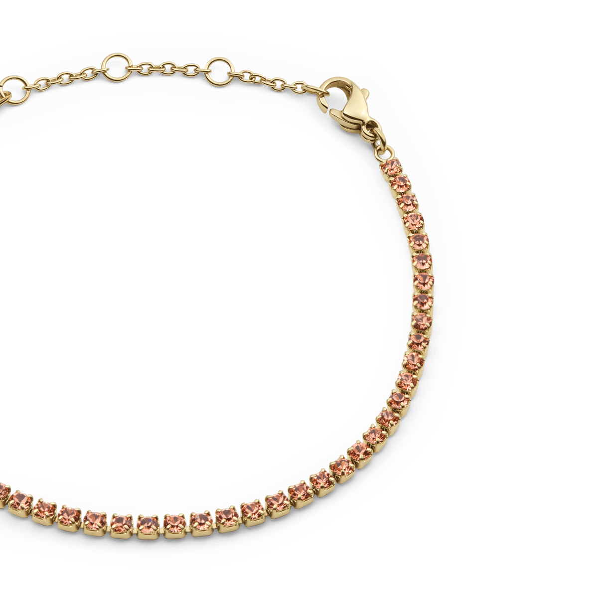 Close-up of the Classic Tennis Bracelet Apricot Gold, showing individually set apricot Preciosa crystals in a slim gold-plated chain with an adjustable clasp.