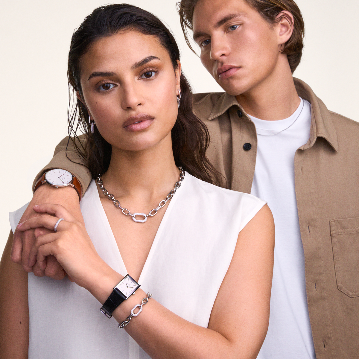 Woman wearing Bound Black Crocodile Silver rectangular watch with black leather strap, styled with silver jewellery.