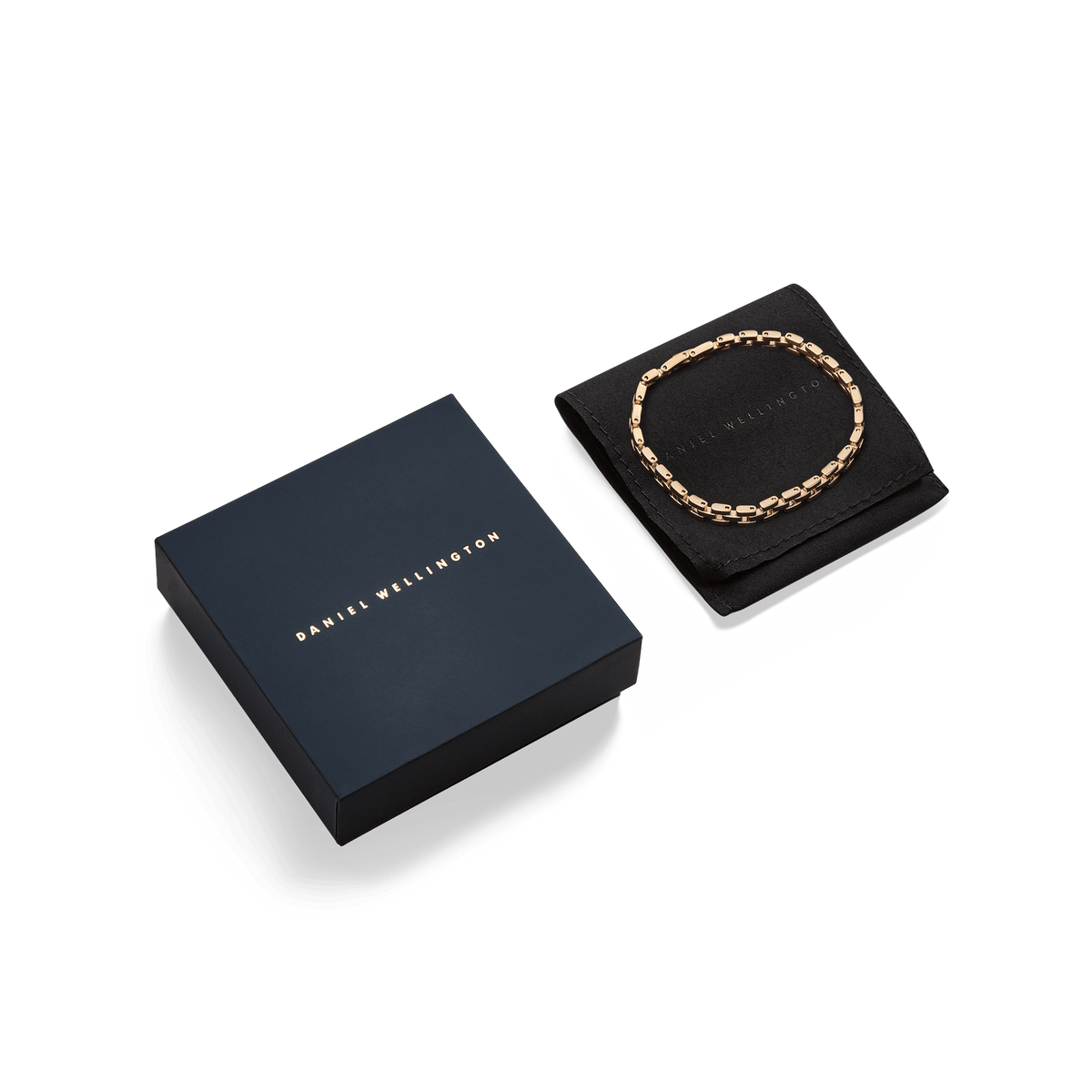 3-Link Bracelet Gold displayed on a black pouch next to an elegant Daniel Wellington gift box, highlighting its suitability for gifting.