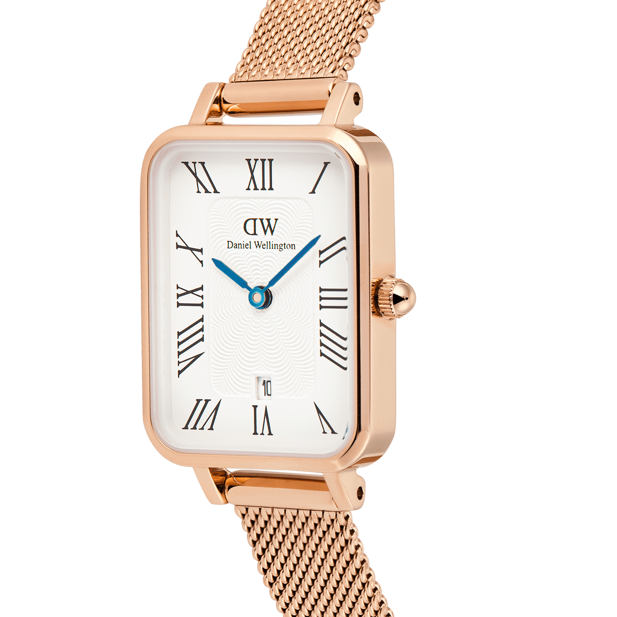 Close-up of the Quadro Melrose women’s watch with a rectangular rose gold case, white dial featuring Roman numerals, blue hands, guilloché detailing, and a rose gold mesh strap. The date window is positioned at 6 o’clock for added practicality.
