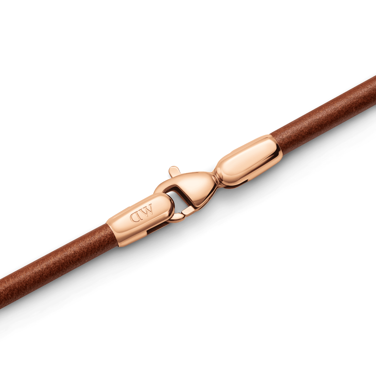 Close-up of the St Mawes Bracelet Rose Gold, highlighting the polished rose gold lobster clasp and smooth brown leather strap.