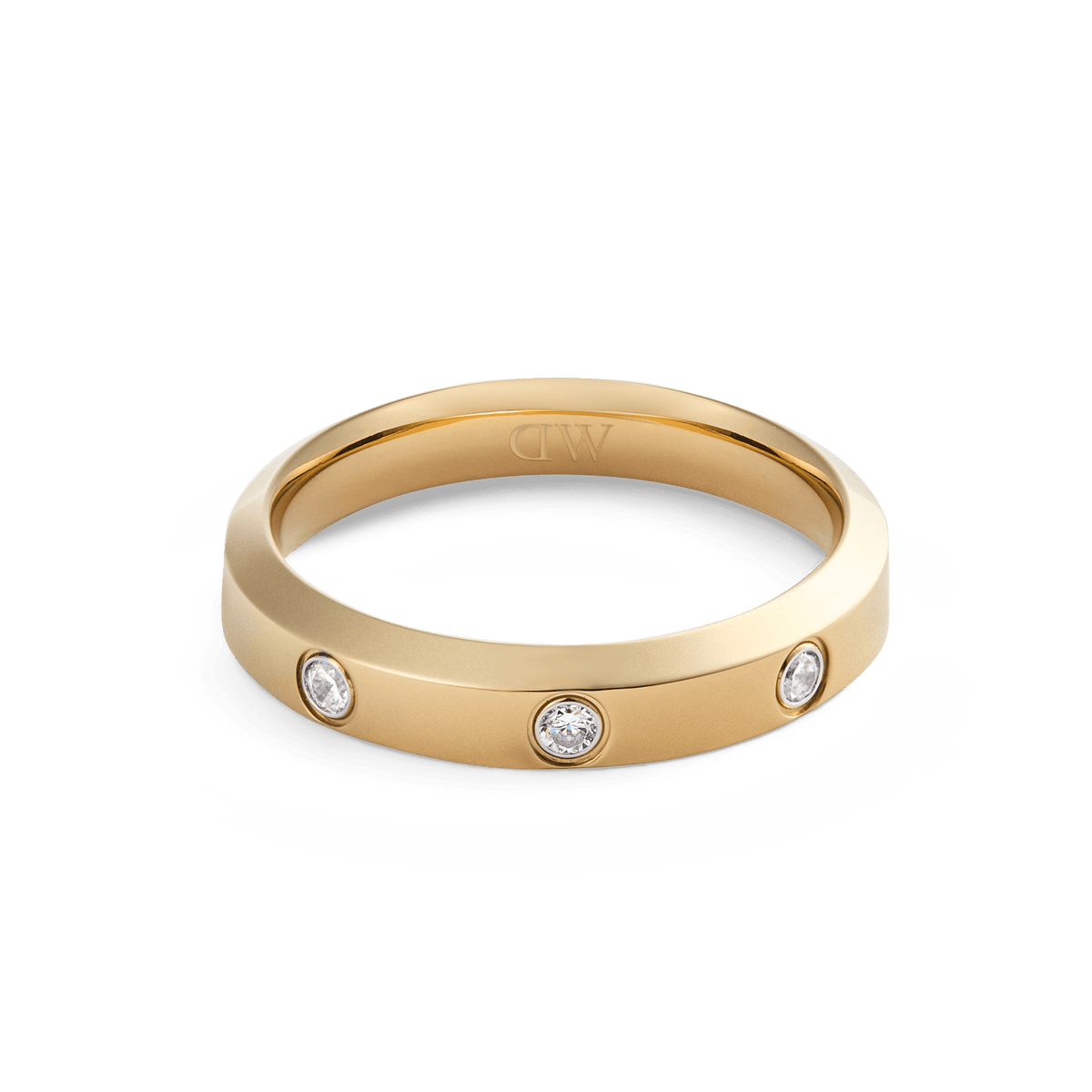 Classic Lumine Ring Gold 4 mm with a sleek gold band, set with three sparkling cubic zirconia stones and finished in polished PVD gold plating for a minimalist, elegant look.