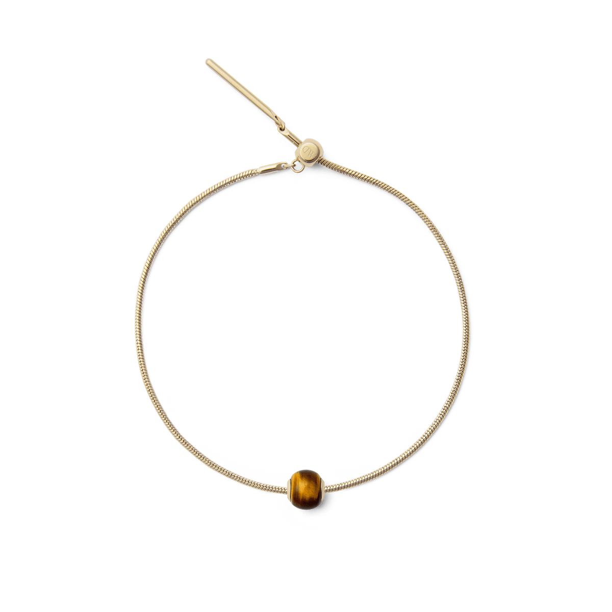 Gold snake chain bracelet featuring a polished tiger eye orb charm with natural golden-brown tones, offering a refined and versatile accent for everyday wear.