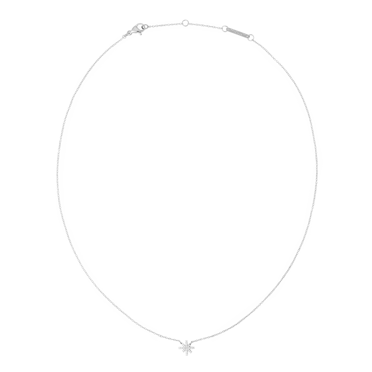 Delicate silver necklace featuring a fine chain and a star-shaped pendant adorned with white cubic zirconia crystals, designed for a subtle, elegant shimmer.
