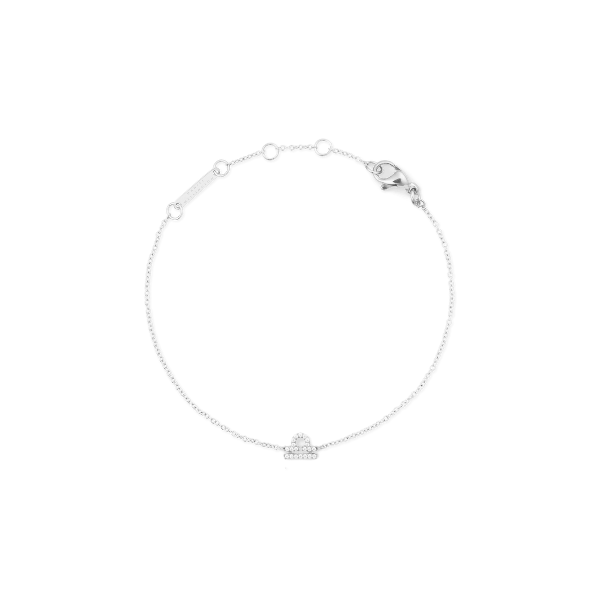 Delicate silver chain bracelet featuring an adjustable fit and a sparkling cubic zirconia Libra zodiac charm at the centre.