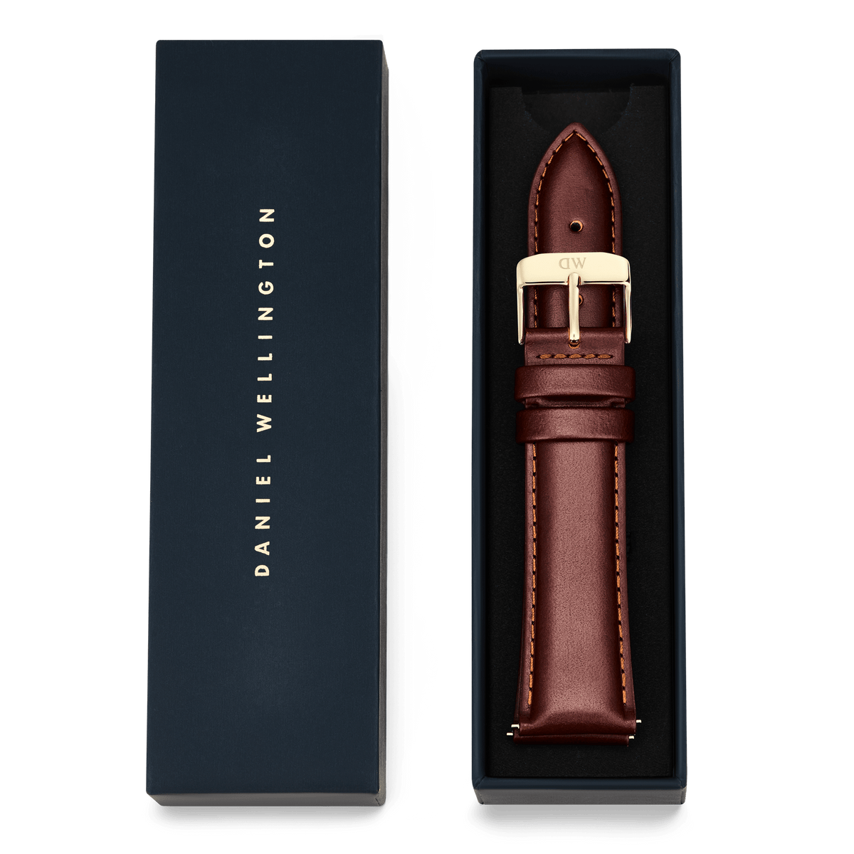 Tapered St Mawes Strap Gold presented in a navy Daniel Wellington gift box, featuring genuine brown leather with contrast stitching and a polished gold buckle for an elegant, refined finish.