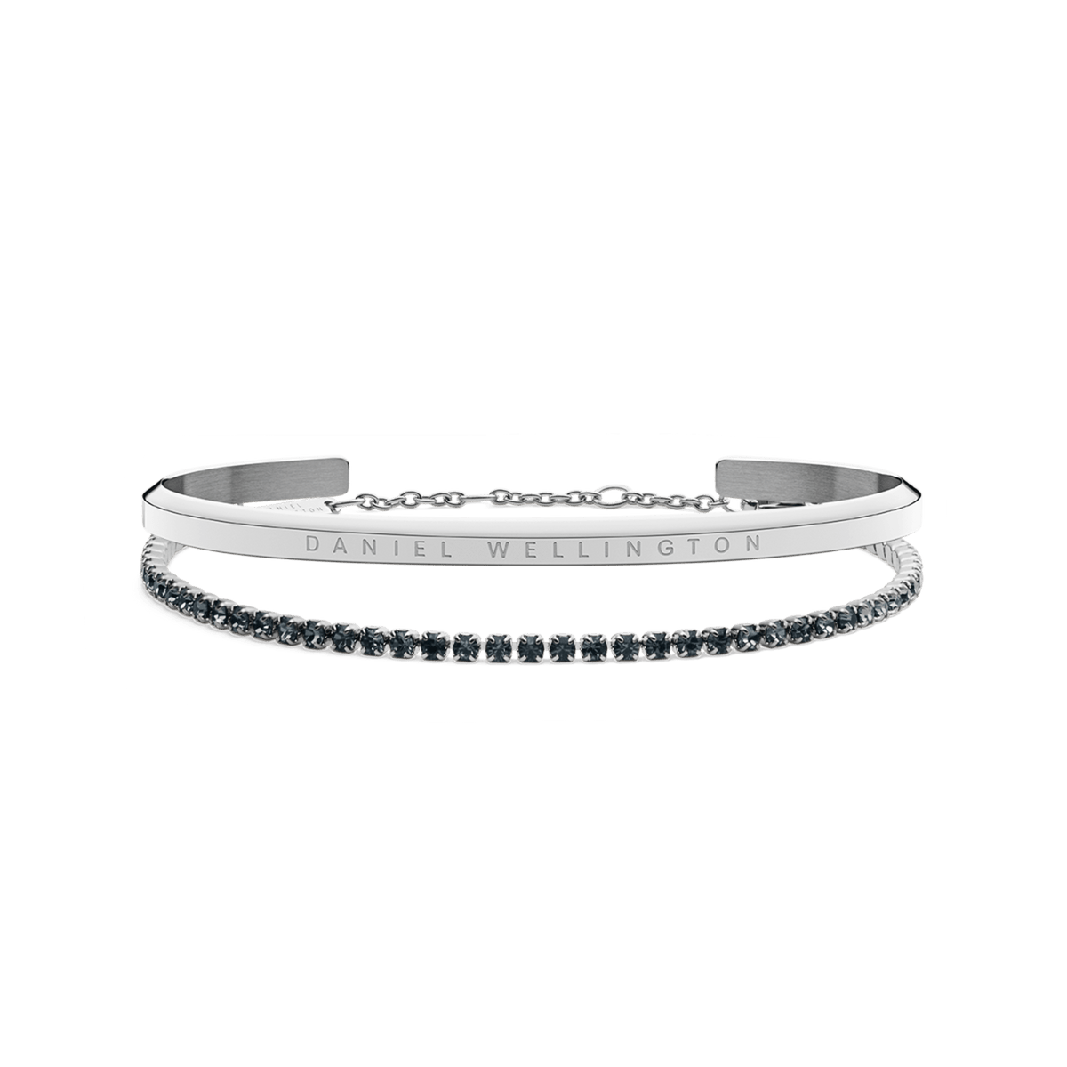 Two silver Daniel Wellington bracelets are shown: one with a polished, minimalist band engraved with the brand name, and the other a delicate tennis bracelet adorned with sparkling stones, both styled together for an elegant, contemporary look.