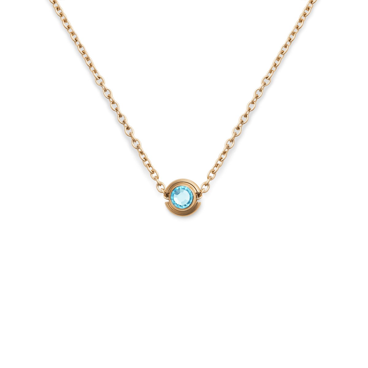 Gold necklace featuring a turquoise blue December birthstone charm set in a minimal gold-plated stainless steel pendant.