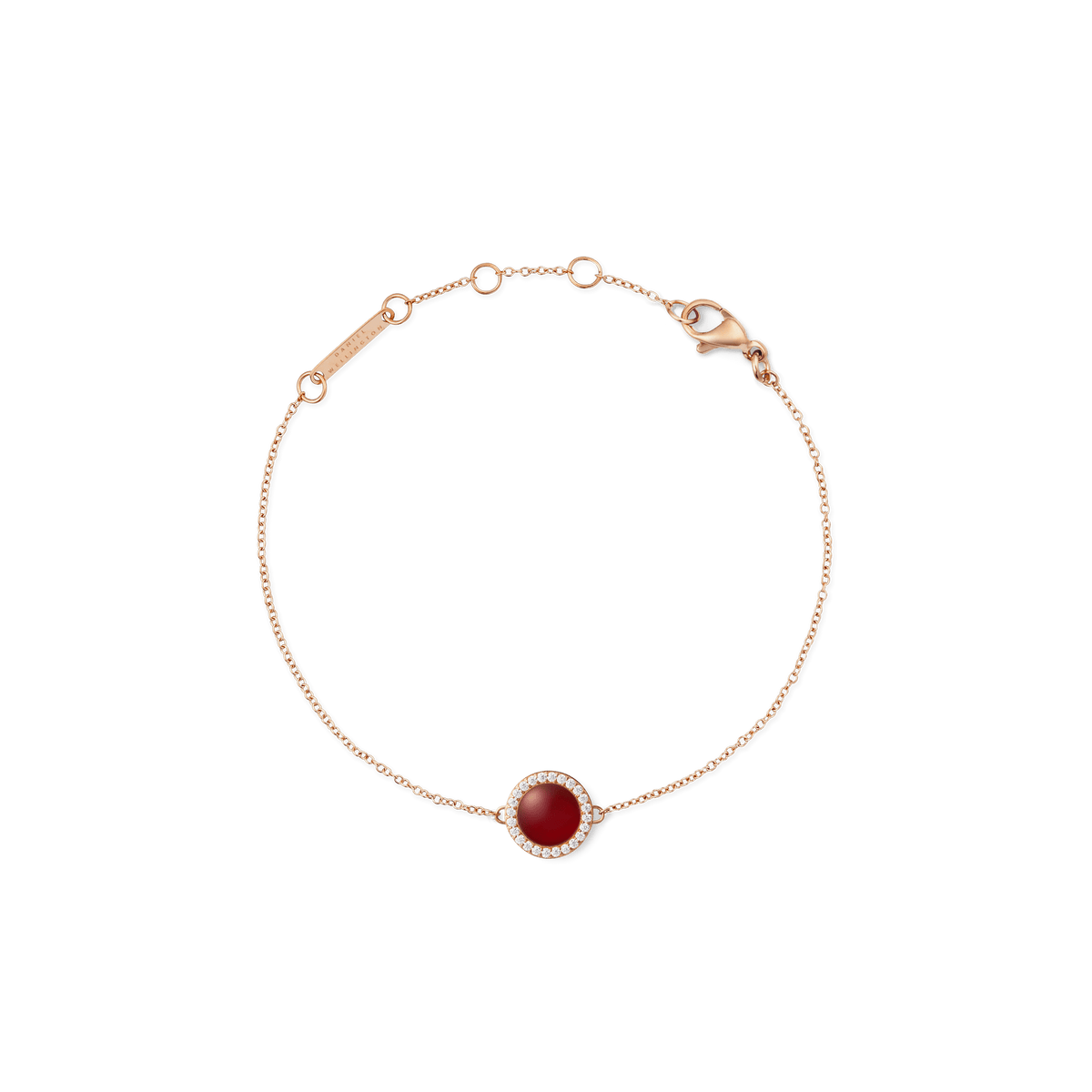 Rose gold bracelet with a central red agate stone and white cubic zirconia accents on a fine adjustable chain.