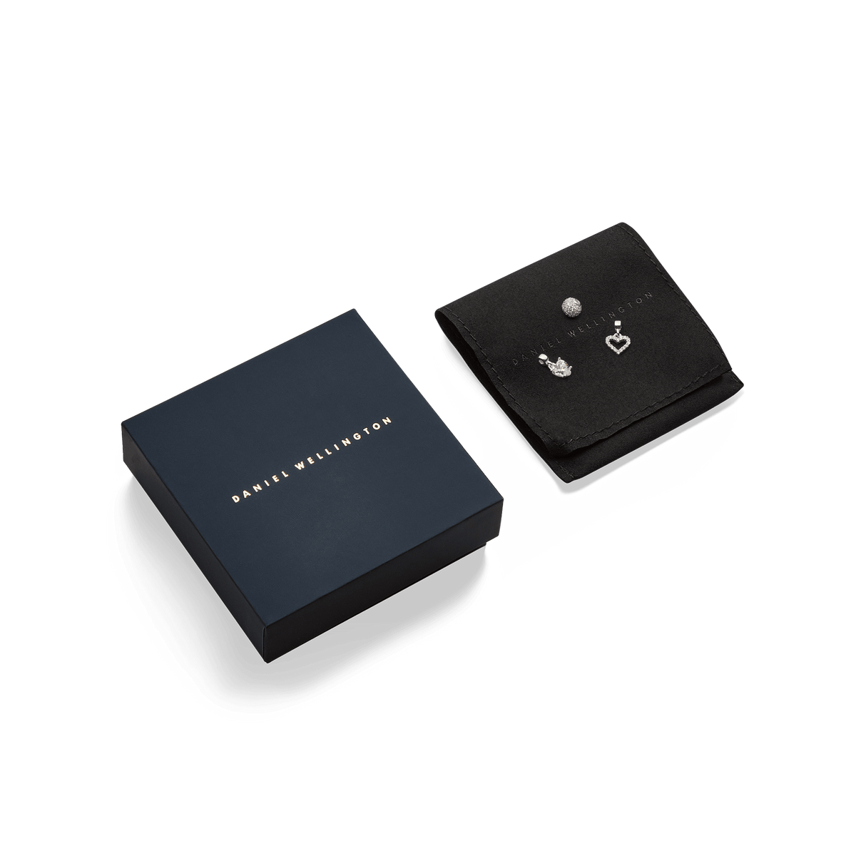 Pavé Orb White Crystal Charm displayed with other silver charms on a black jewellery pouch beside a navy Daniel Wellington gift box.