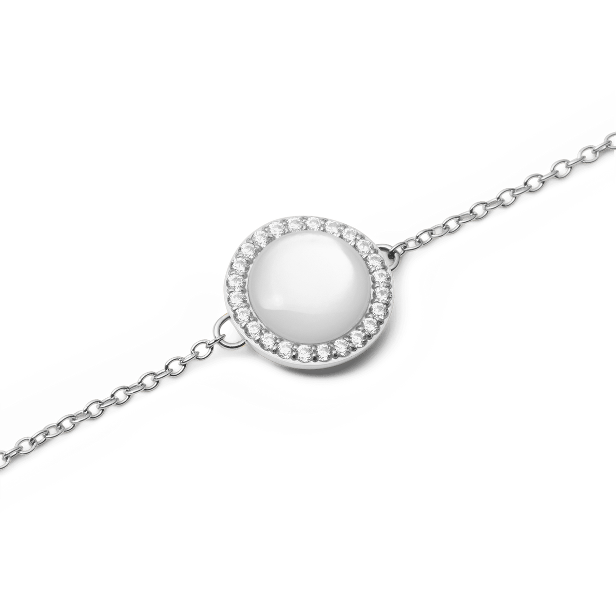 Close-up of Audrey Bracelet Mother of Pearl Silver featuring a domed pearl charm with cubic zirconia halo on a fine silver chain.