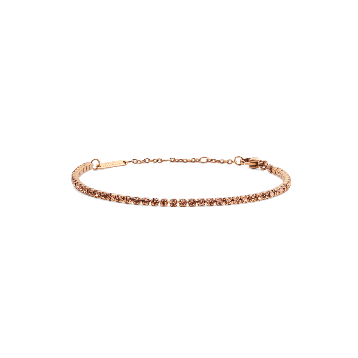 Slim rose gold tennis bracelet featuring a row of apricot-coloured Preciosa crystals, with an adjustable chain and secure lobster clasp for a refined, elegant finish.
