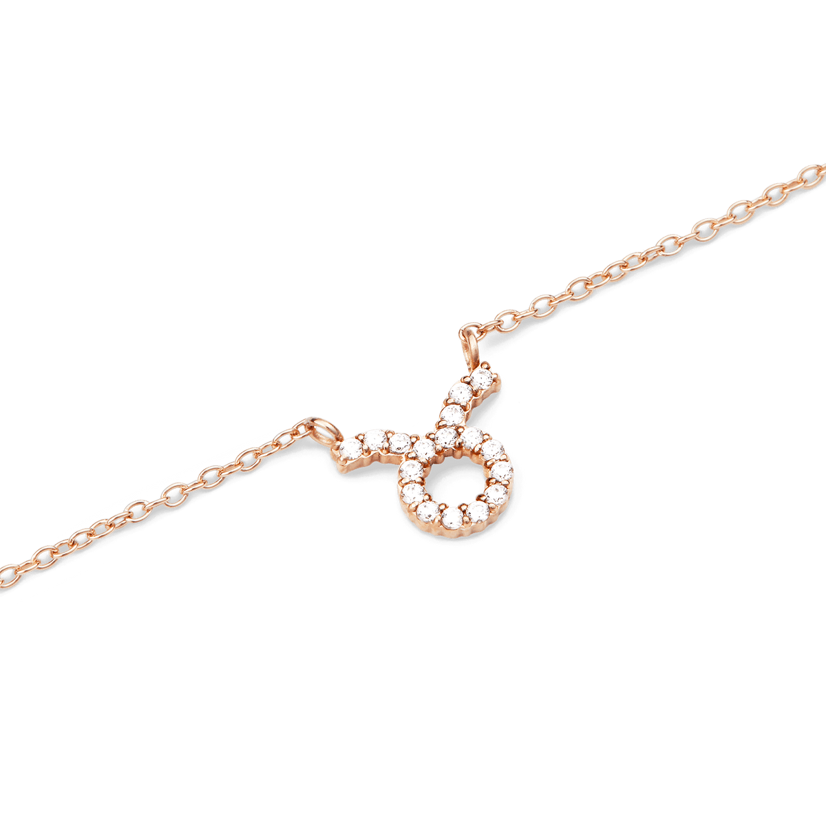 Rose gold chain necklace featuring a Taurus zodiac pendant adorned with sparkling hand-set crystals.