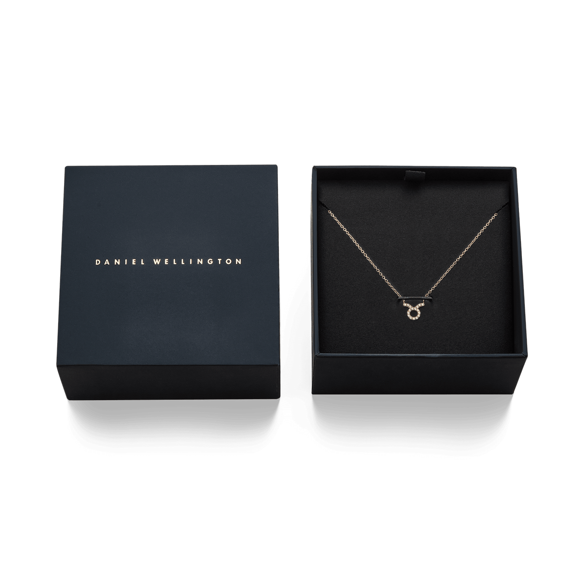 Crystal Zodiac Chain Necklace Gold with a sparkling Taurus pendant, elegantly displayed in a Daniel Wellington gift box.