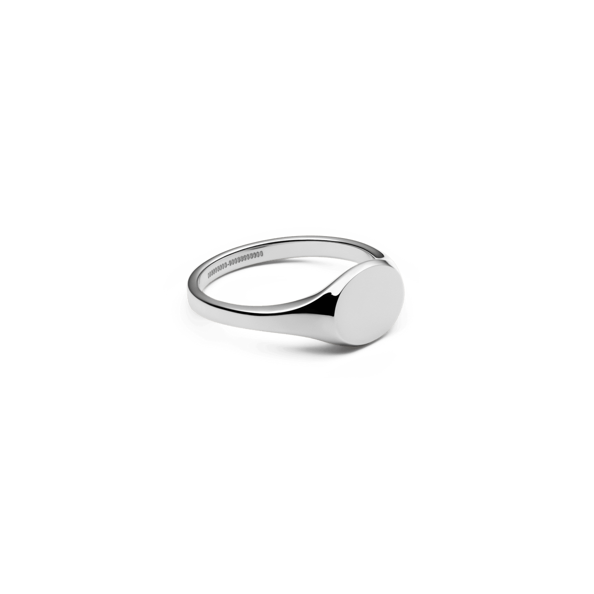 Classic Mini Signet Ring Silver with a smooth, round engraveable face and a polished 316L stainless steel band, shown from a side angle to highlight its minimalist design.