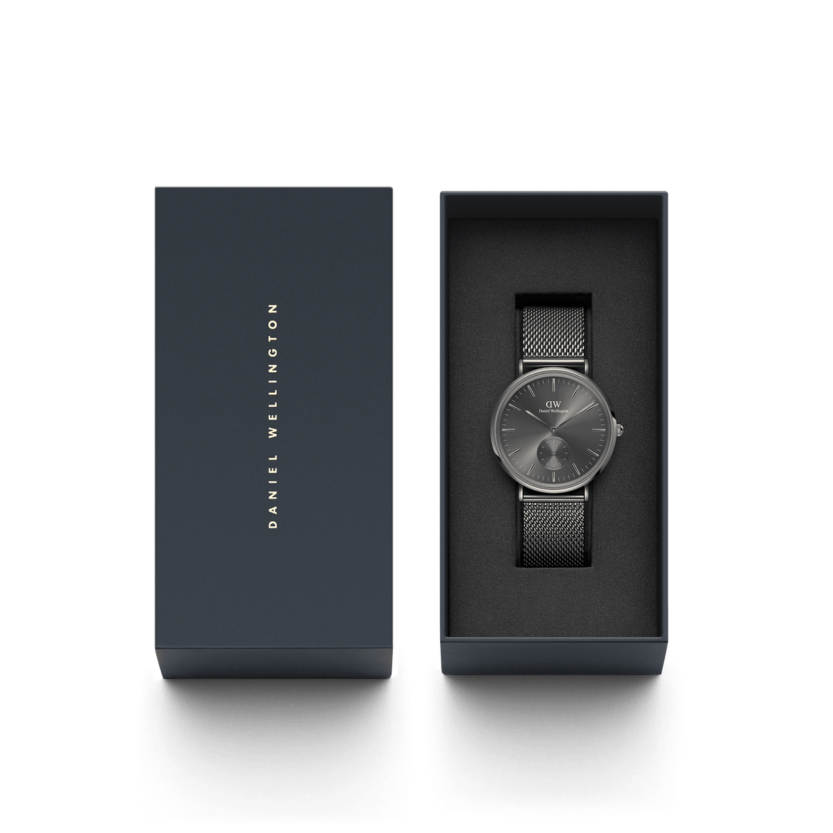 Classic Multi-Eye Mesh Graphite watch by Daniel Wellington presented in its signature dark gift box with the lid beside it.