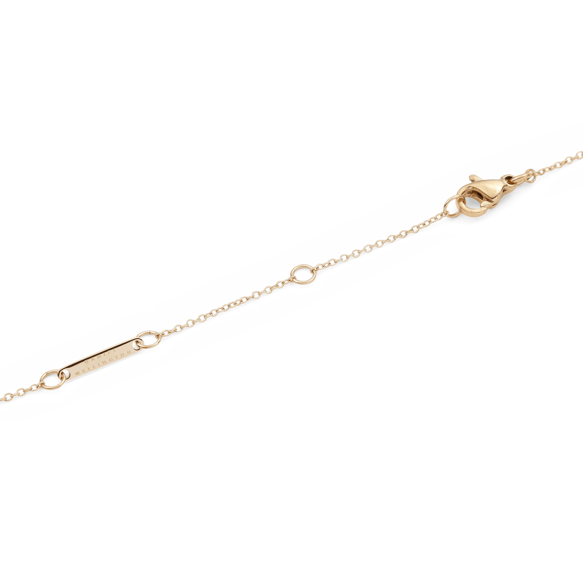 Close-up of the Crystal Zodiac Chain Necklace Gold’s adjustable gold chain with a secure lobster clasp and branded tag.