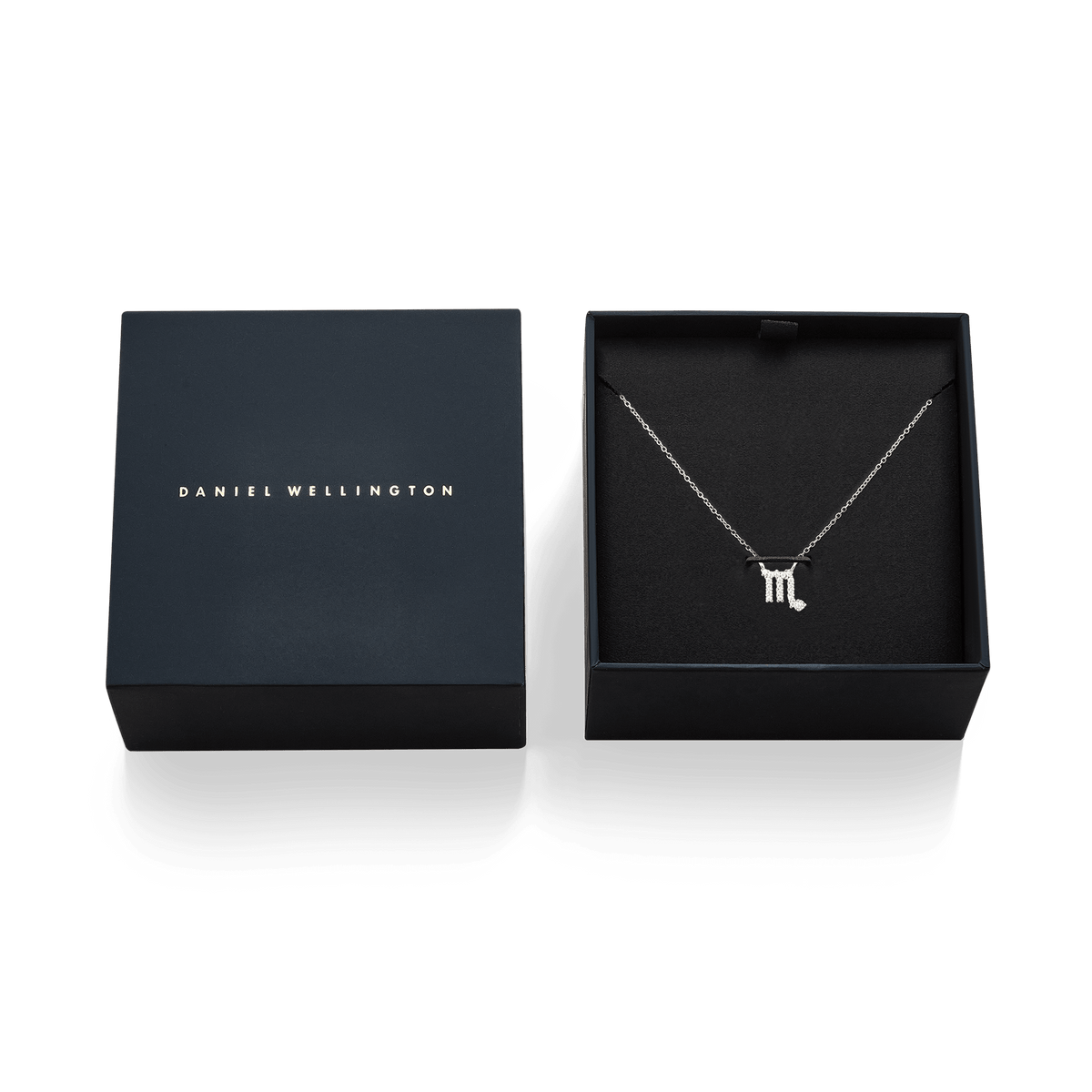 Crystal Zodiac Chain Necklace Silver with a sparkling Scorpio pendant, elegantly displayed in a black Daniel Wellington gift box.