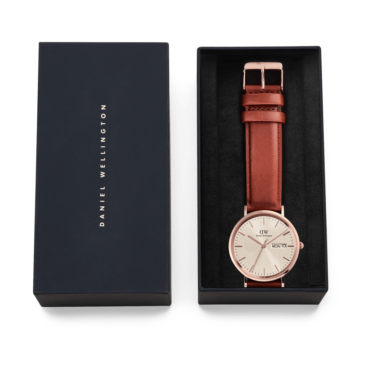 Classic Day Display St Mawes Rose Gold Champagne watch with a brown leather strap, presented in an elegant Daniel Wellington gift box with the lid beside it.