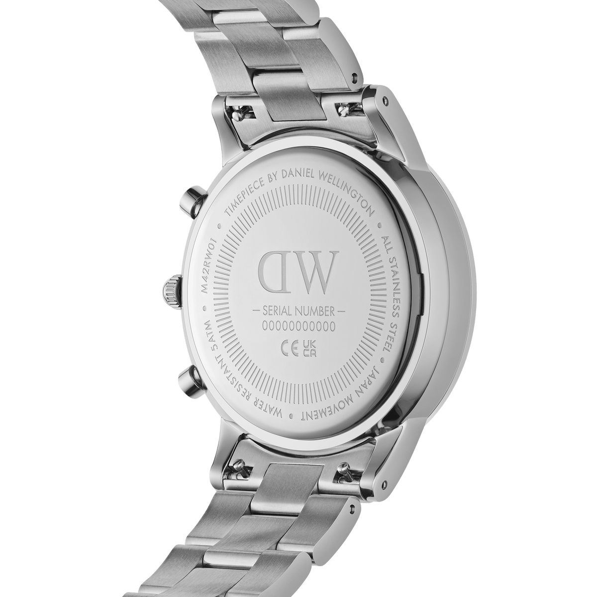 Close-up of the case back of the Iconic Chronograph Link Onyx S, showing the engraved Daniel Wellington branding, stainless steel construction, and brushed silver link bracelet.
