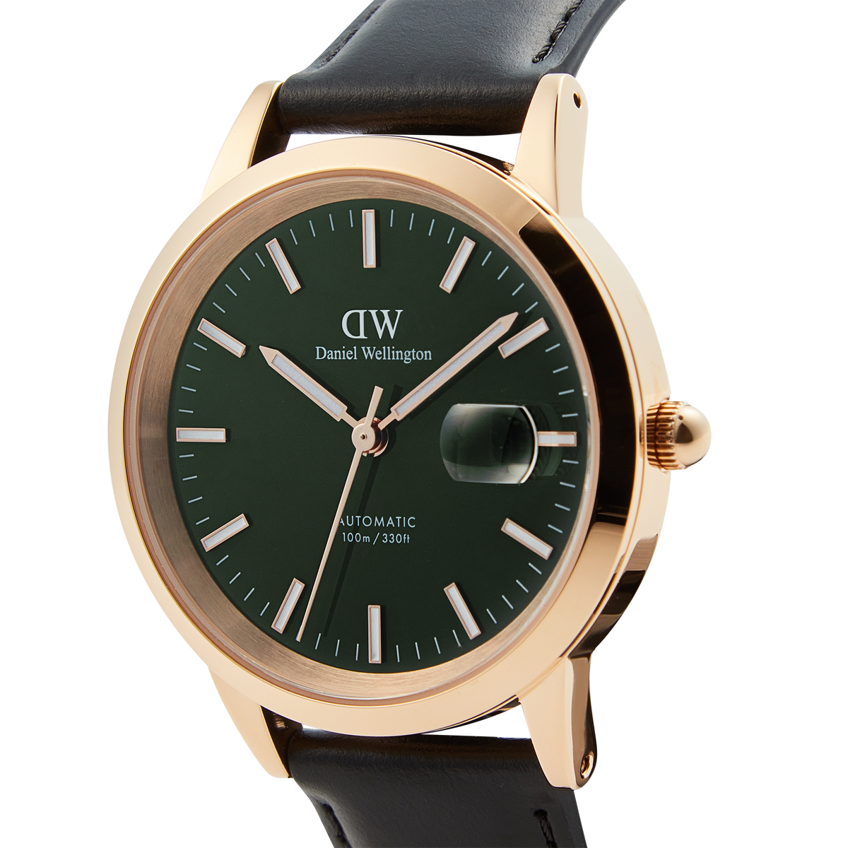 Close-up of the Daniel Wellington Iconic Sheffield Automatic Rose Gold watch, showing its emerald green enamel dial, rose gold case, magnified date window, and black leather strap.
