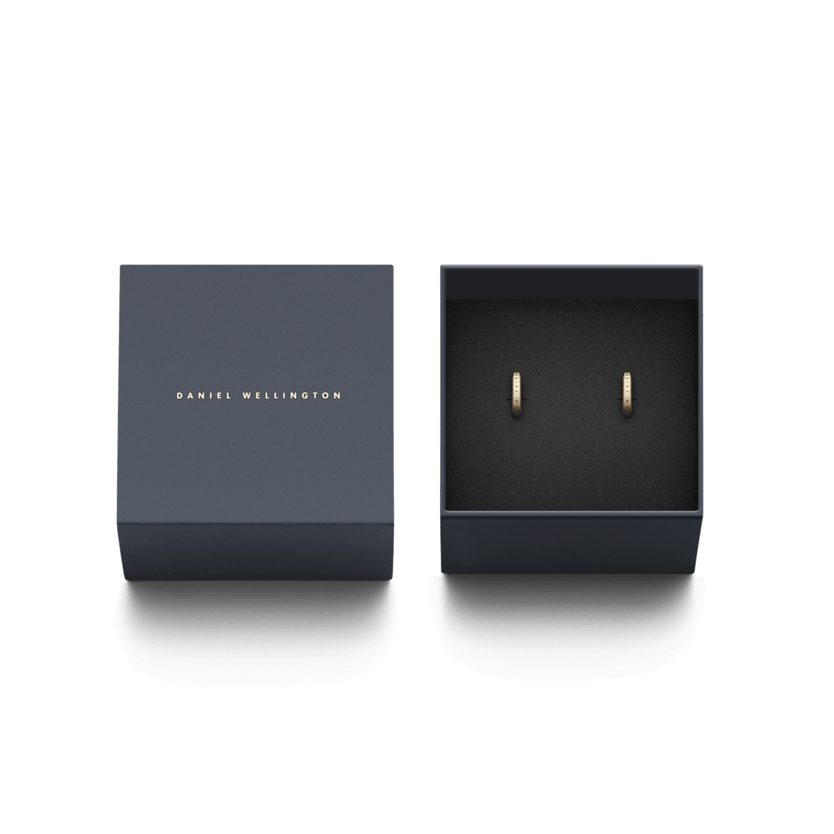Pair of Elan Earrings Gold displayed in an elegant Daniel Wellington branded gift box, featuring minimalist gold hoops with subtle logo engraving, ideal for everyday wear or gifting.