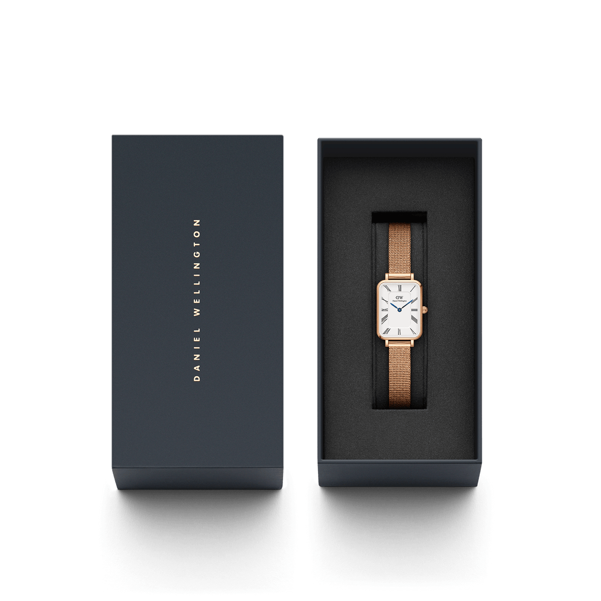Quadro Roman Numerals Melrose rose gold rectangular watch with a mesh strap, presented in an elegant Daniel Wellington gift box.