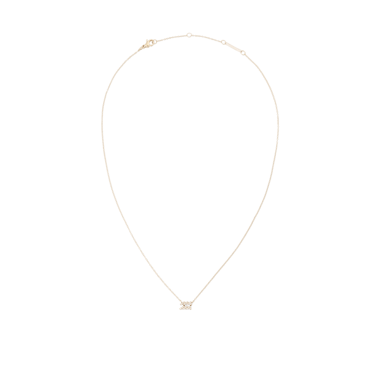 Fine gold chain necklace featuring a minimalist zodiac pendant set with sparkling crystals.