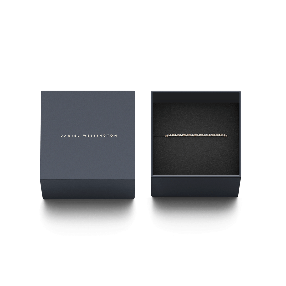 Classic Tennis Bracelet Rose Gold presented in an elegant dark gift box with Daniel Wellington branding, highlighting the slim rose gold chain and sparkling cubic zirconia crystals.