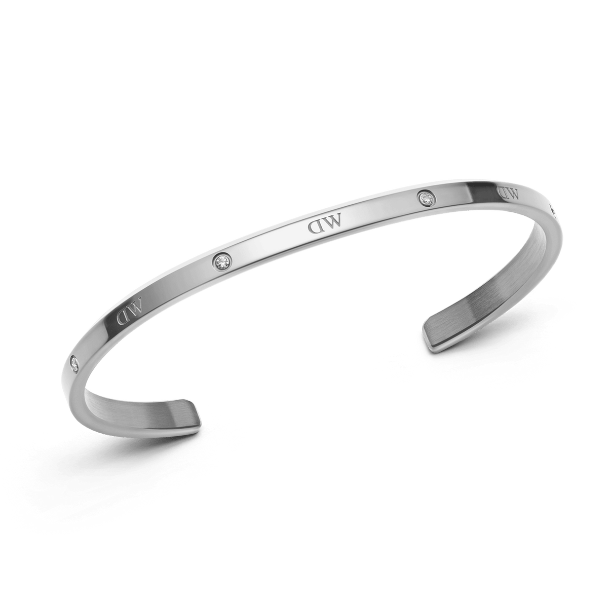 Slim silver Classic Lumine Bracelet S with an open cuff design, featuring six sparkling crystals and engraved detailing along the polished stainless steel band.